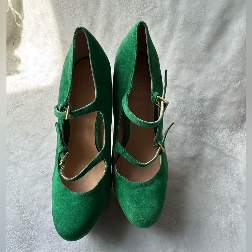 Green and purple platform shoes with a high heel and buckle closure.